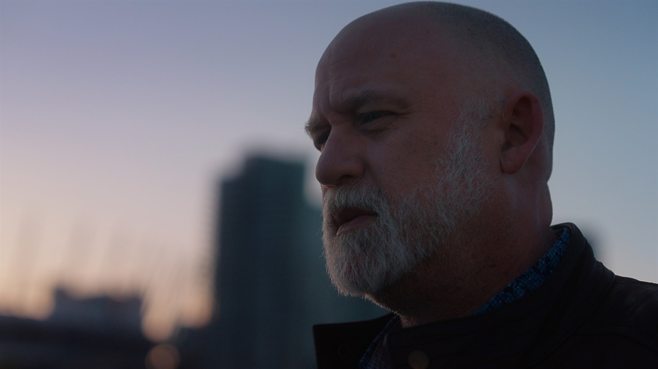 Close up of a bald man with a beard